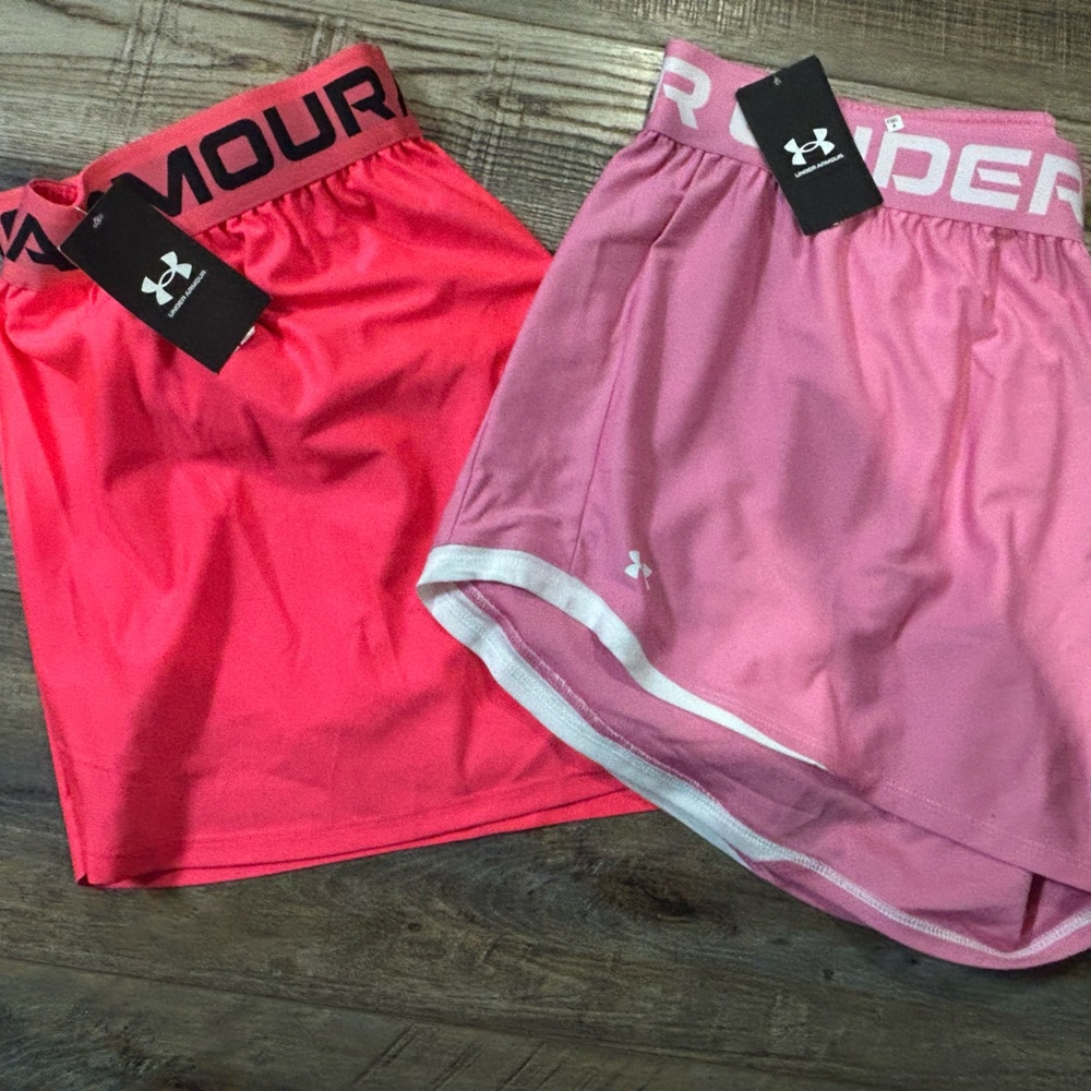 2 pairs Under Armour Women's Athletic Shorts in light and dark pink